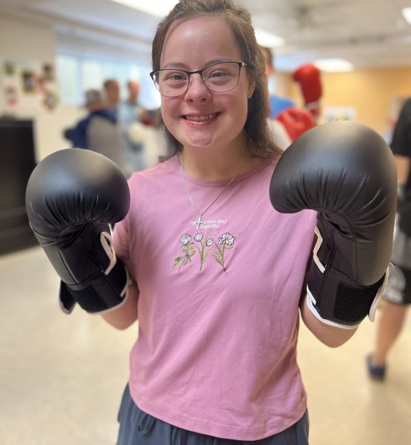 Person served smiling holding boxing gloves on!